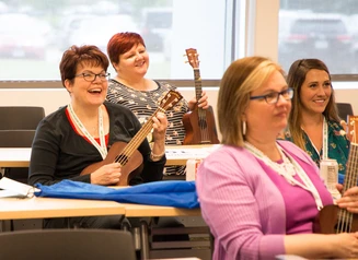 Ukelele players in a classroom