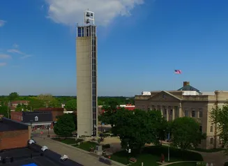 Tower and buildings with street scene from above 