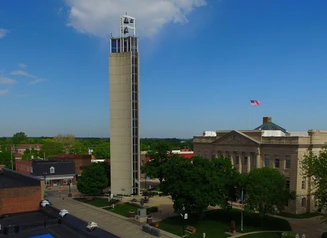 Tower and buildings with street scene from above 