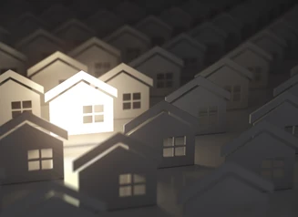 Illustration of homes with one lit up