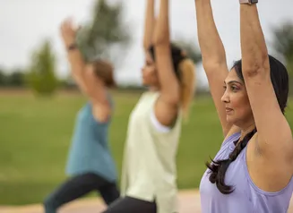 Close up of people doing yoga