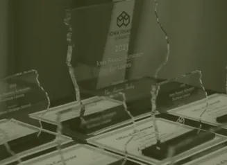 IFA Top Lender plaques and certificates/awards on desk