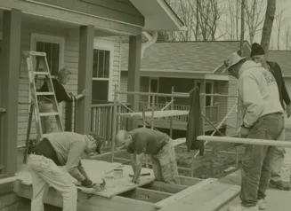 group of Habitat for Humanity volunteers working on house construction