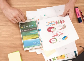 Person reviewing charts and graphs