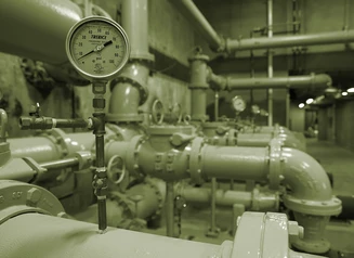 Pipes and gauge inside water treatment facility