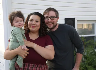 The Gorsett family in front of their home 