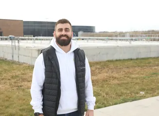 The City Administrator of Nevada in front of the city's water treatment plant