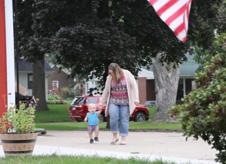 woman and child walking together