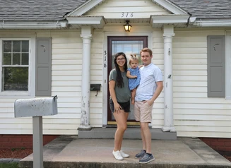 family standing on their front porch