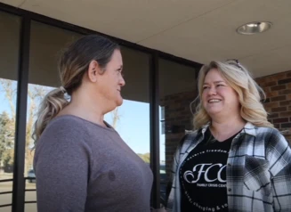 two women talking together