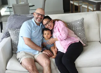 Family of three on couch