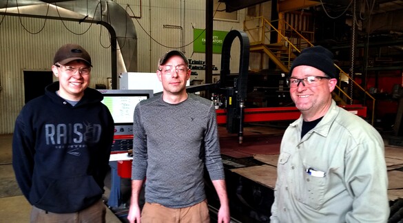 Intern Ethan Rasque, General Manager Tyler Verdon and Shop Supervisor Trent Mitchell