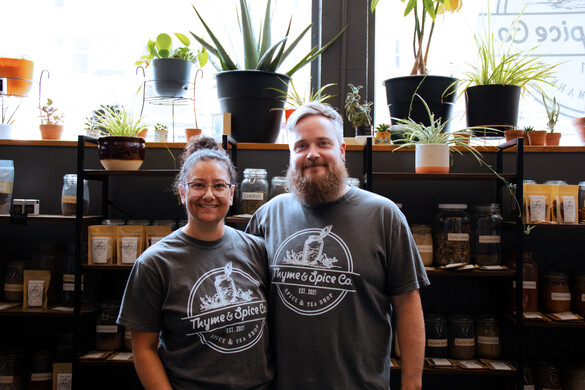 Travis and Ashlyn Long in their shop wearing Thyme & Spice Co tee shirts