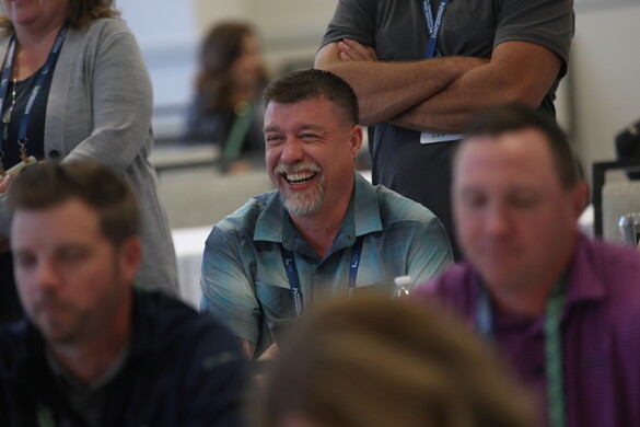 man laughing in an audience