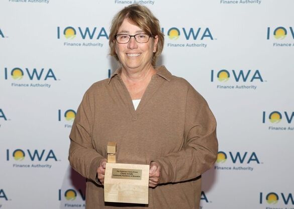 charla shafer posing with an award