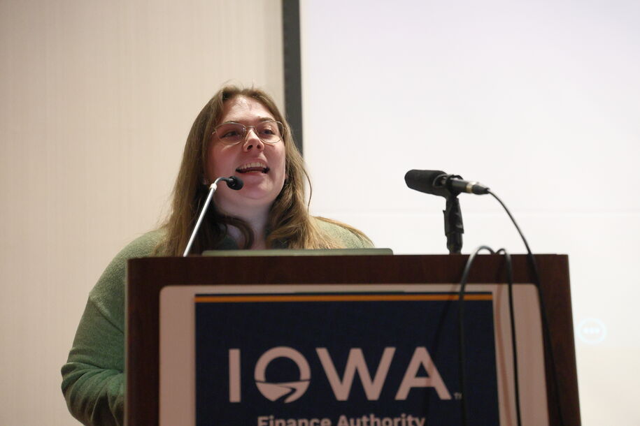 Female speaking at podium